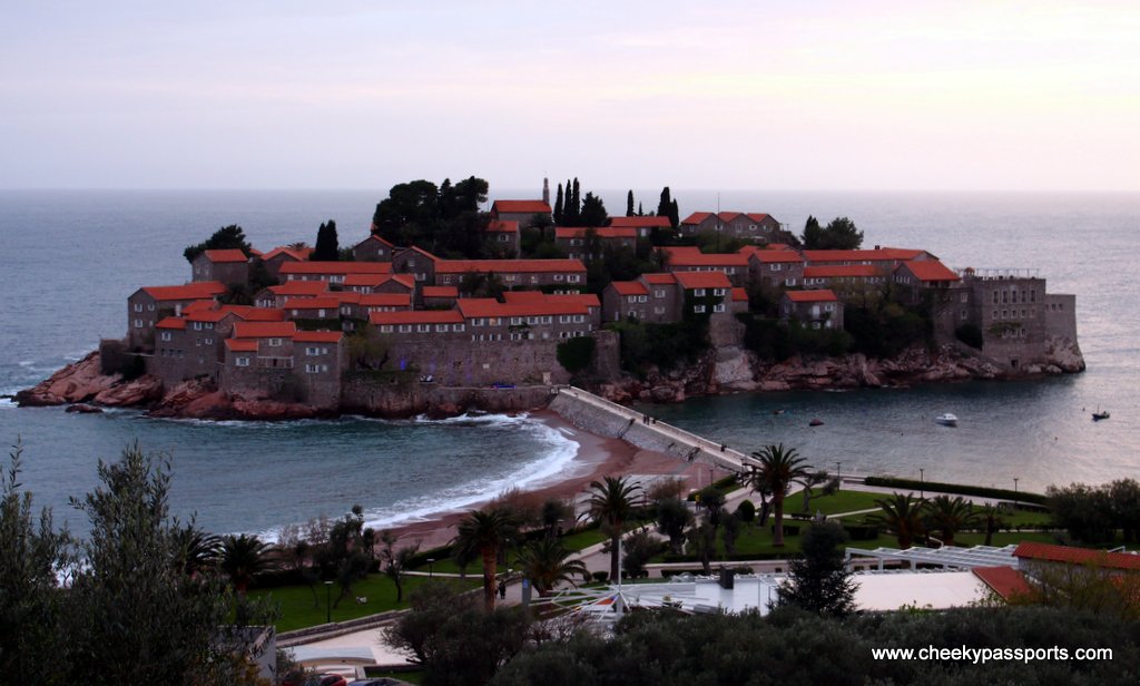 Sveti Stefan separated from the mainland by a sand bar - a top reason to visit Montenegro