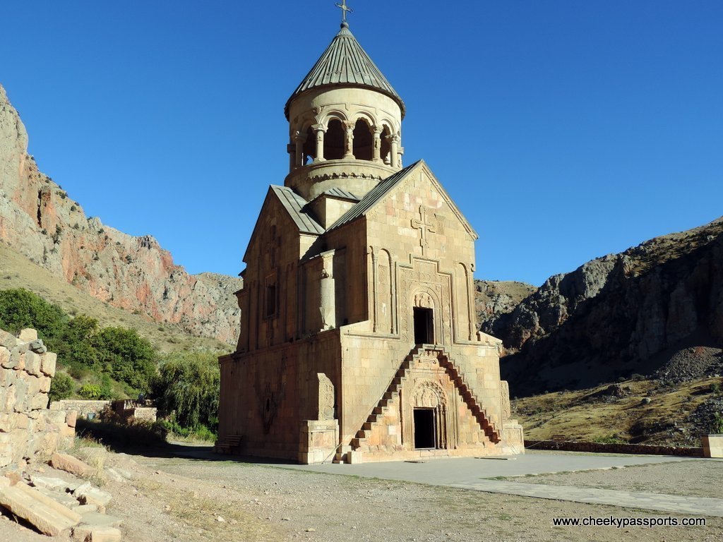 One of the churches with the Noravank monastery complex surrounded by red cliffs
