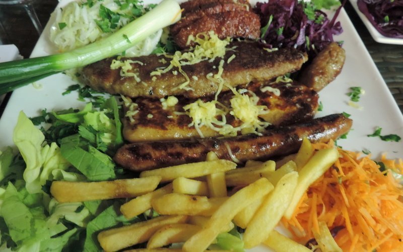 A selection of meats, sausages and salad at a restaurant in Kosovo
