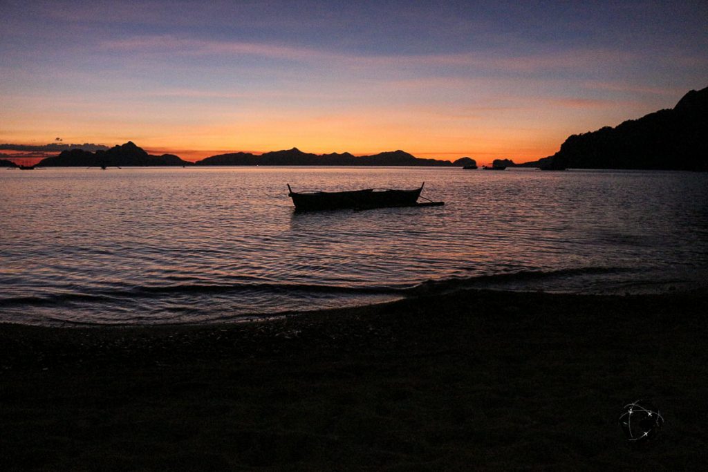 Philippines travel tips - Sunset view at Corong-Corong featuring a banka
