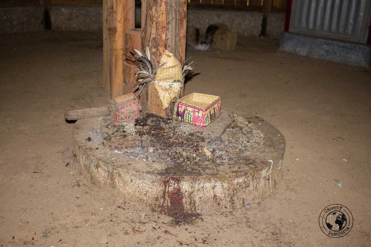 Exploring Indonesia - The sacrificial stone inside the magic house at the village of Maubesi which we visited whilst exploring west timor, indonesia