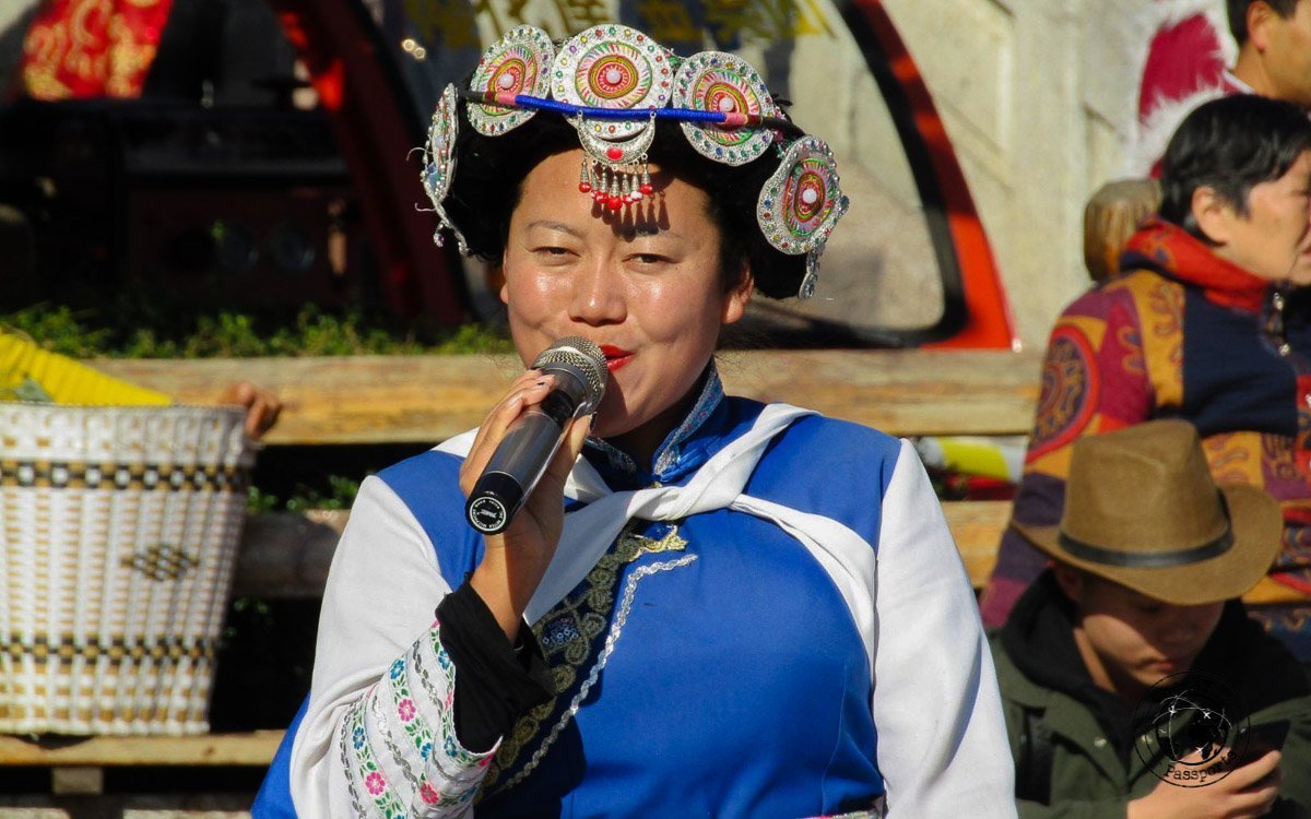 Traditional Naxi dancing in the square - Lijiang attractions, Yunnan, China