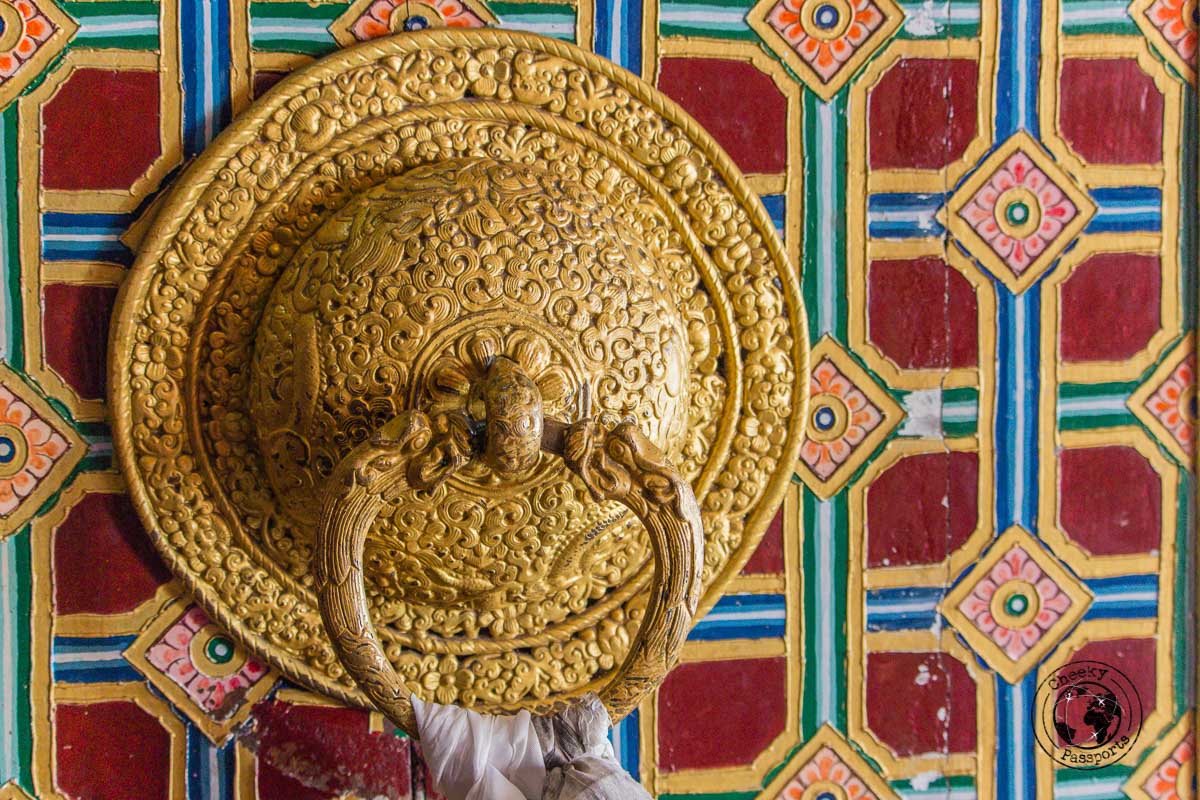 Decorated golden door knob at the tawang monastery - Guide to Sela Pass, Tawang Monastery and other Places to Visit in Tawang