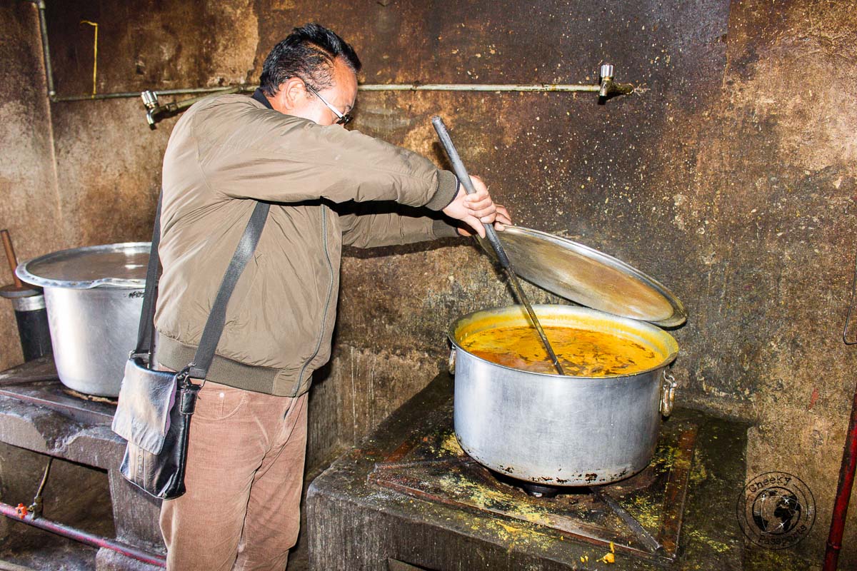 Preparing lunch for the monastery students is a tough job and requires a huge pan - Guide to Sela Pass, Tawang Monastery and other Places to Visit in Tawang