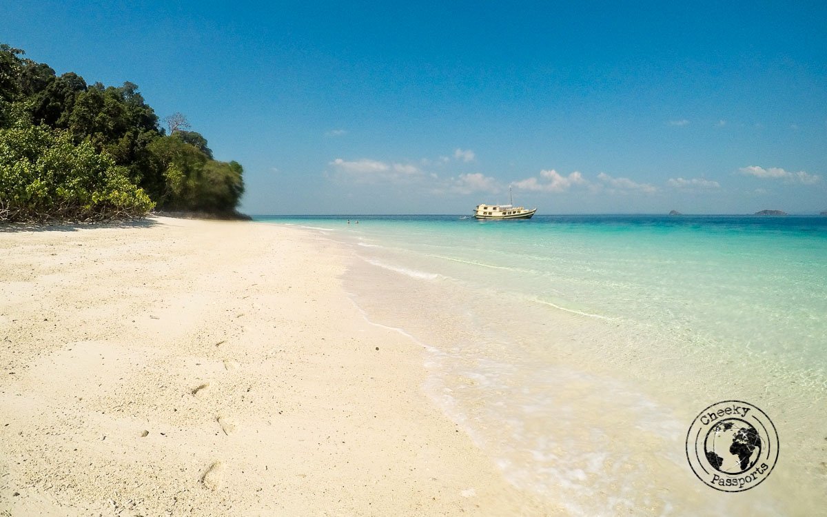 More white sand with the Sea Gypsy as a backdrop