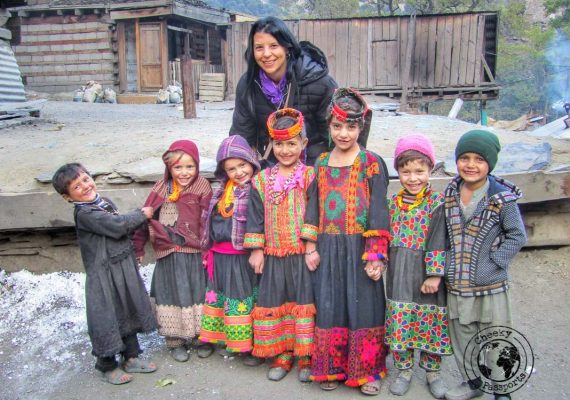 Michelle with children from Kalasha - places to visit in Pakistan